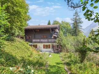 Nestled in a serene, nature-filled setting, this charming property offers a tranquil escape.