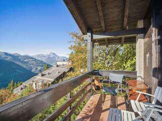 Enjoy breathtaking mountain views from this stunning balcony.