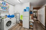 This laundry room offers a practical and organized space for all your washing needs.