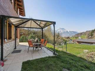Enjoy breathtaking mountain views from this charming property.