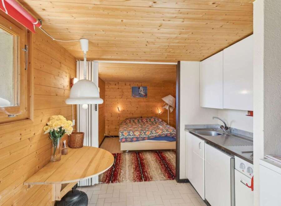 Discover the charm of this cozy cabin, featuring warm wooden interiors and a functional layout.