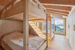 Experience the ultimate in alpine luxury with this stunning bunk bed setup.