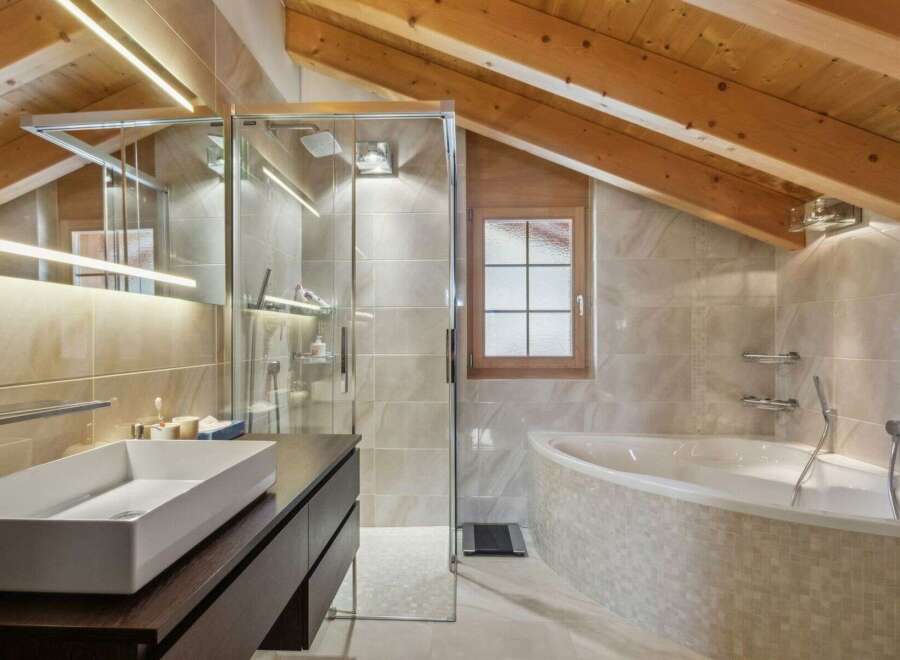 This stunning bathroom boasts a modern design with a touch of rustic charm.