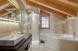 This stunning bathroom boasts a modern design with a touch of rustic charm.