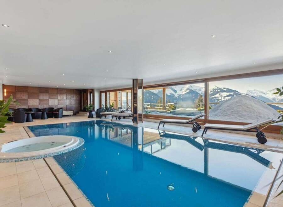 Indulge in luxury with this stunning indoor pool, offering breathtaking mountain views.