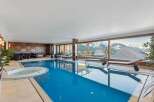 Indulge in luxury with this stunning indoor pool, offering breathtaking mountain views.