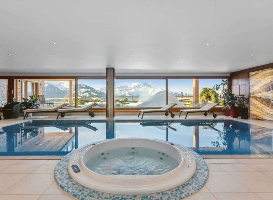 Indulge in luxury at this stunning property featuring an indoor pool and jacuzzi, perfect for relaxation.