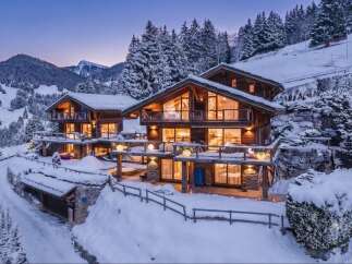 Experience luxury mountain living in this stunning chalet, nestled amidst snow-covered pines and majestic peaks.