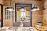 Step into rustic elegance with this stunning property, showcasing a warm and inviting interior.