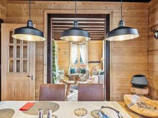 Step into rustic elegance with this stunning property, showcasing a warm and inviting interior.