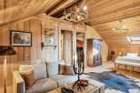Step into rustic elegance with this stunning property, showcasing a warm, inviting interior.