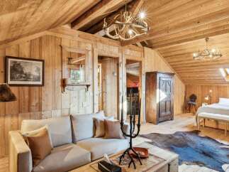 Step into rustic elegance with this stunning property, showcasing a warm, inviting interior.