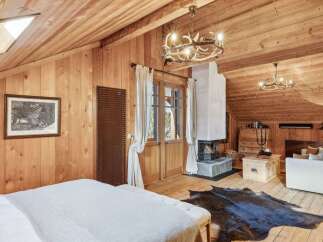 This stunning property boasts a cozy and inviting interior, perfect for a relaxing retreat.