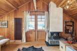 Experience the charm of this stunning cabin retreat, featuring a cozy fireplace and breathtaking mountain views.