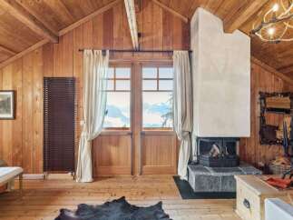 Experience the charm of this stunning cabin retreat, featuring a cozy fireplace and breathtaking mountain views.