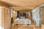 Step into rustic elegance with this stunning property, featuring a warm wooden interior and a cozy ambiance.