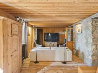 Step into rustic elegance with this stunning property, featuring a warm wooden interior and a cozy ambiance.