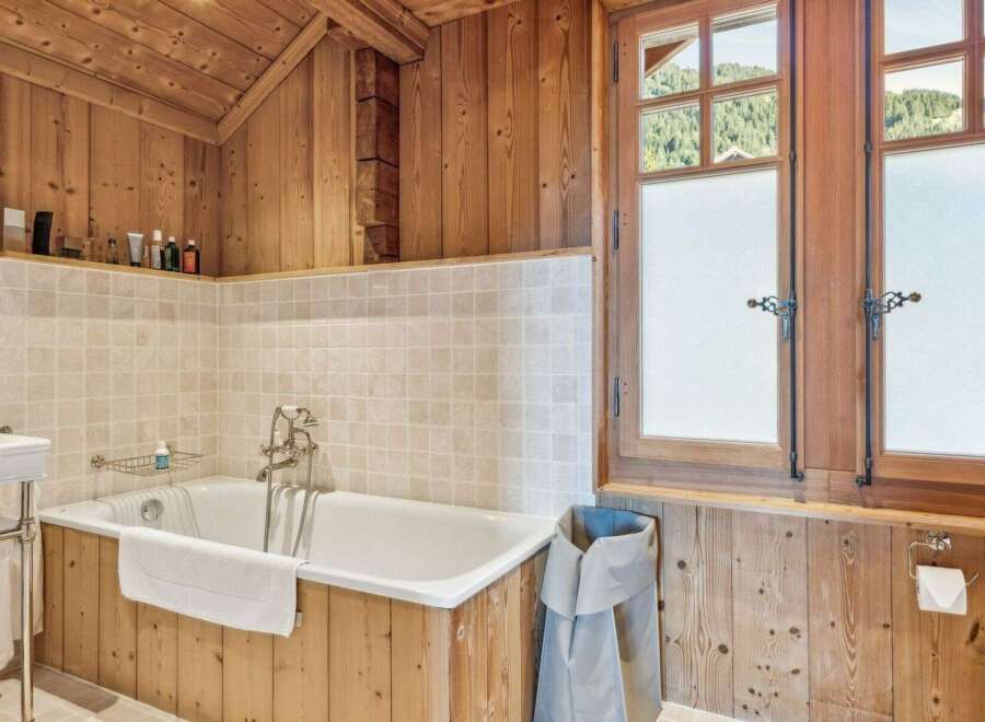 This stunning bathroom features a luxurious bathtub, perfect for unwinding after a long day.