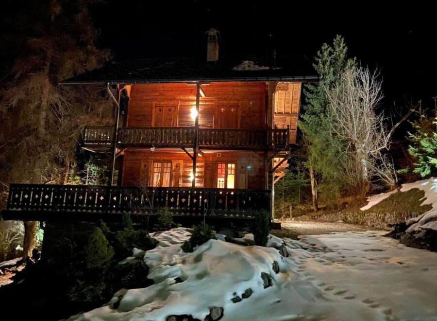 Experience the charm of this stunning wooden chalet nestled in a serene, snowy landscape.