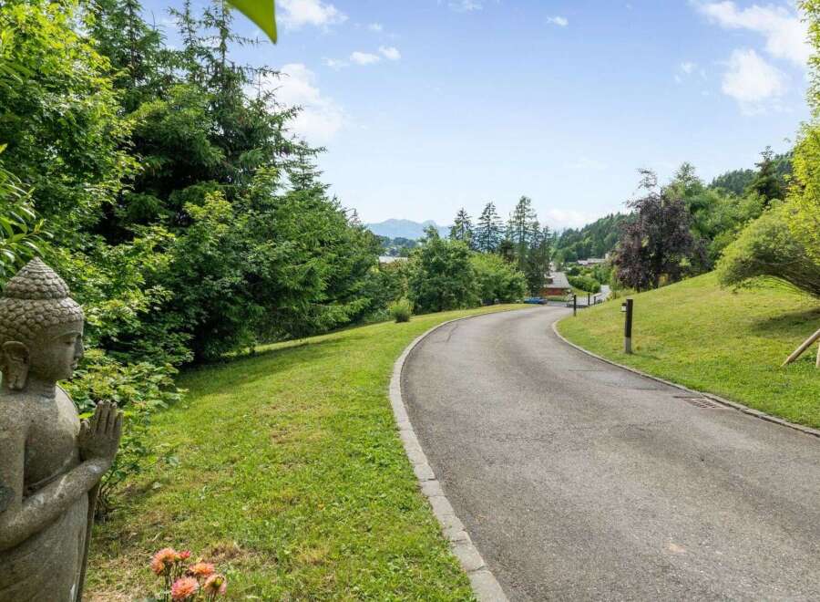 Discover serenity and elegance in this stunning property, featuring a winding driveway that leads to your dream home.