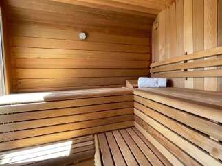 Step into relaxation with this stunning sauna, designed for ultimate comfort and rejuvenation.