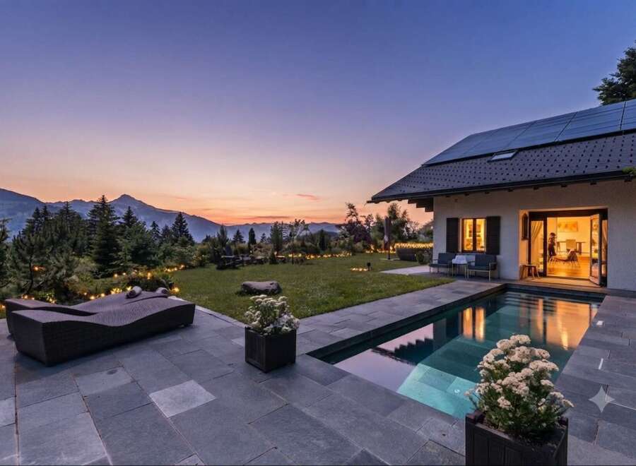 Experience luxury living with this stunning mountain view property featuring a private pool and expansive patio.