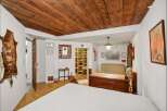 Step into rustic charm with this unique property featuring a stunning wooden ceiling and a cozy, inviting atmosphere.