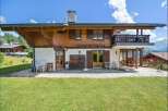 Discover the charm of this stunning property, boasting a beautiful wooden facade and a spacious balcony with breathtaking mountain views.