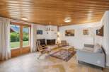 Experience cozy living in this charming living room featuring a modern fireplace and comfortable seating.