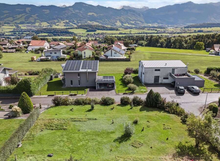 Discover this stunning property featuring a modern house with solar panels, offering sustainable living and energy efficiency.