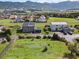 Discover this stunning property featuring a modern house with solar panels, offering sustainable living and energy efficiency.