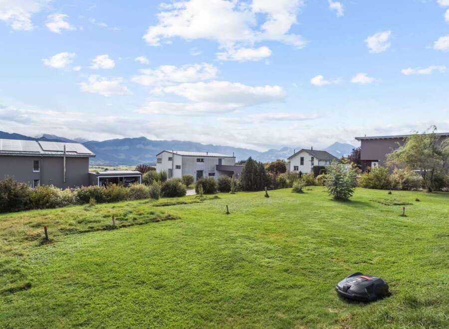 Discover the charm of this stunning property, boasting a meticulously maintained lawn and picturesque mountain views.