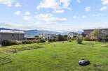 Discover the charm of this stunning property, boasting a meticulously maintained lawn and picturesque mountain views.