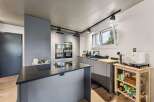 Modern kitchen design with sleek gray cabinetry and a stylish island.