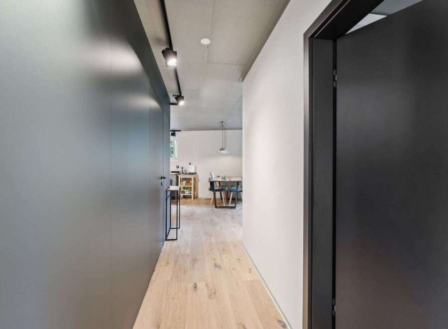 Step into modern elegance with this stunning hallway.