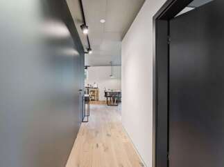 Step into modern elegance with this stunning hallway.