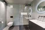 Step into modern luxury with this stunning bathroom design.
