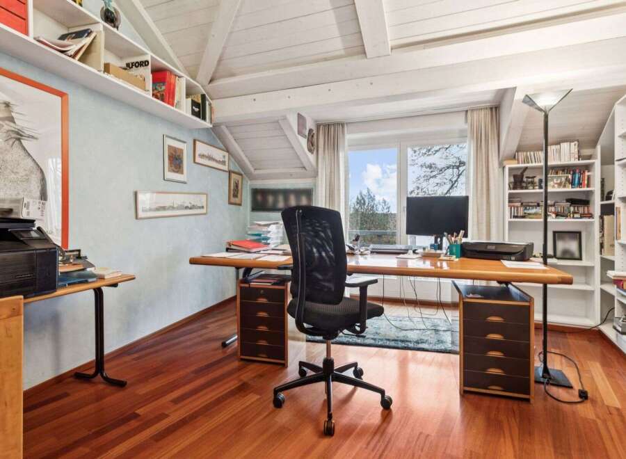 This stunning home office boasts a bright and airy atmosphere, perfect for productivity.