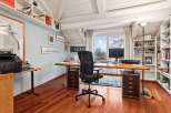 This stunning home office boasts a bright and airy atmosphere, perfect for productivity.