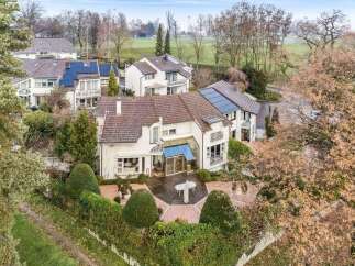 Discover this stunning property featuring a beautifully designed house with a charming patio area.
