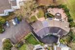 Discover this stunning property featuring a unique architectural design and lush landscaping.