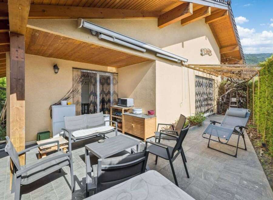 Enjoy outdoor living at its finest with this charming property featuring a covered patio.
