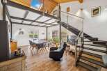 Discover this stunning property featuring a modern interior design with a unique mezzanine level.