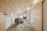 This stunning property features a beautifully designed interior with a focus on natural materials.