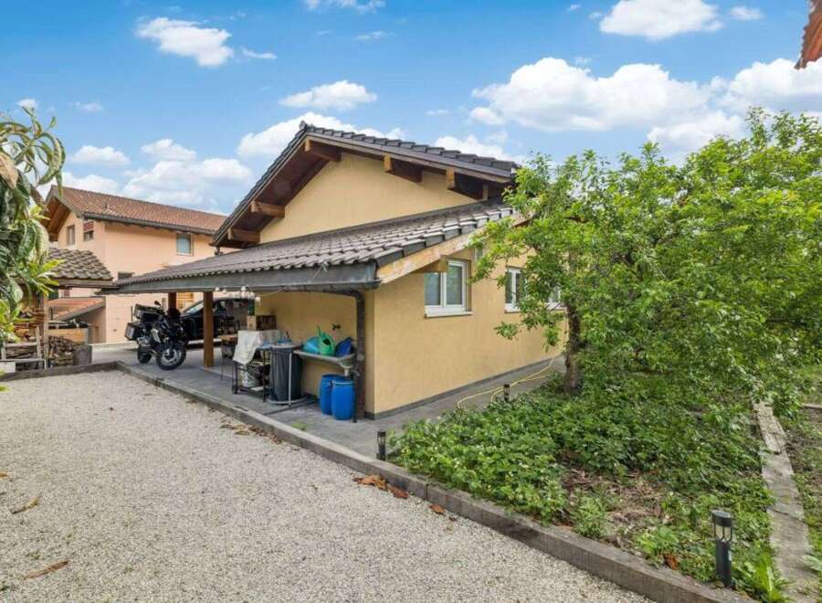 Discover this charming property featuring a well-maintained exterior and a convenient carport.