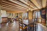 Step into a world of rustic elegance with this stunning property, featuring exposed wooden beams and stone walls that exude timeless charm.