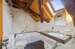 Discover the charm of this unique bathroom, featuring a skylight that floods the space with natural light.