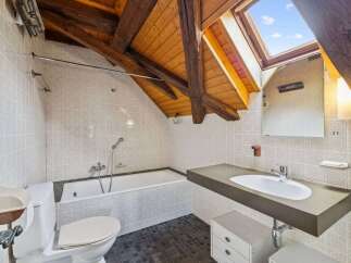 Discover the charm of this unique bathroom, featuring a skylight that floods the space with natural light.