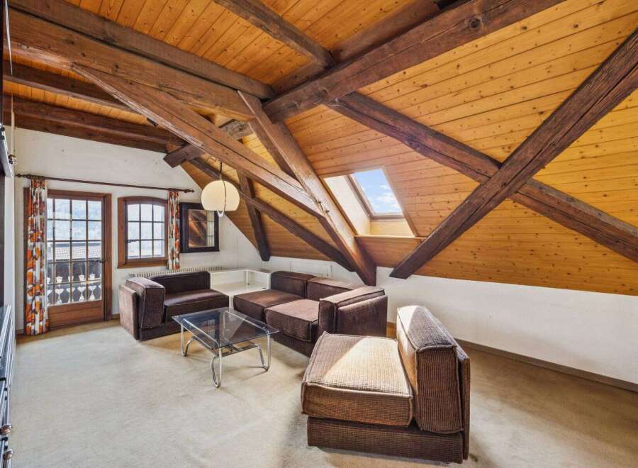 Discover the charm of this unique property featuring a stunning wooden beamed ceiling and a skylight that floods the space with natural light.