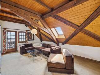 Discover the charm of this unique property featuring a stunning wooden beamed ceiling and a skylight that floods the space with natural light.